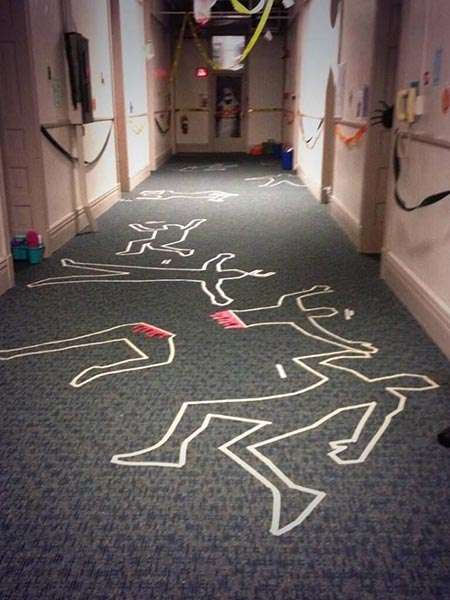 Dead body chalk lines as a Halloween prank in a supermarket staff area