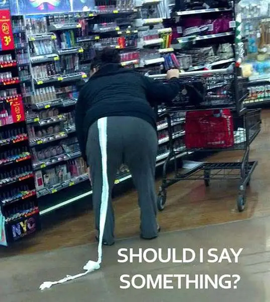 Walmart customer with toilet roll hanging from pants during Halloween.