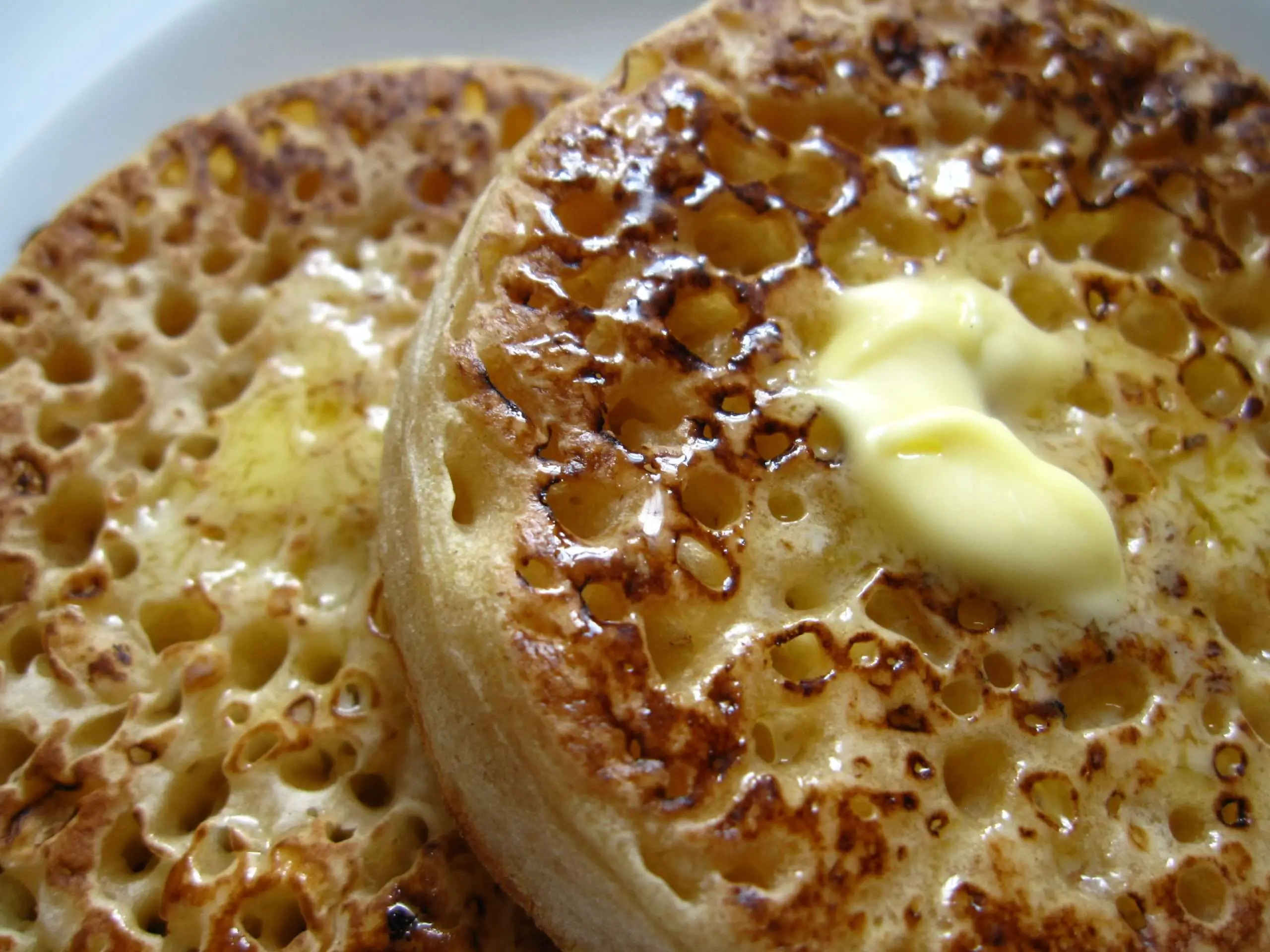 Two crumpets with butter